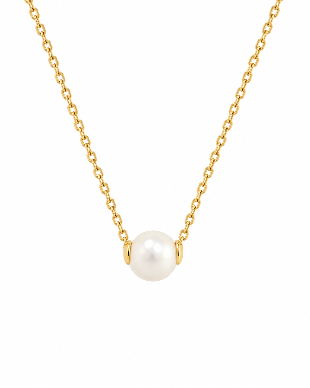 A delicate gold chain necklace featuring a single round white pearl pendant in a simple gold bezel setting, shown against a solid white background.