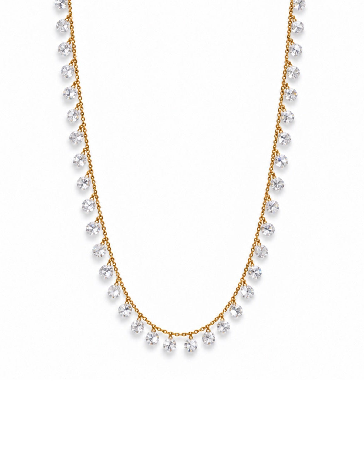 A delicate gold chain necklace featuring a row of clear round-cut gemstones draped in a U-shape, set against a plain white background.