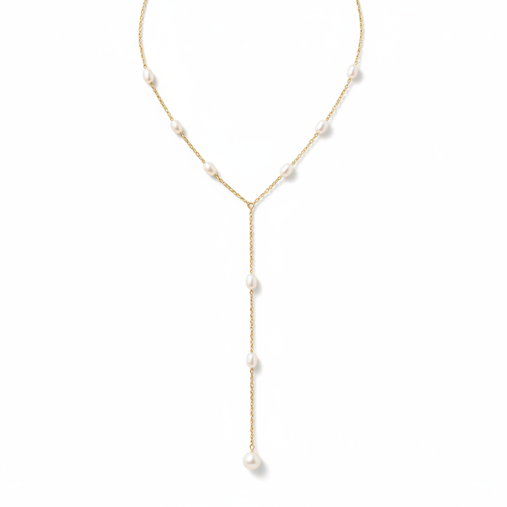 A delicate gold Y-necklace featuring irregular white freshwater pearls spaced along the chain and a long drop pendant with small pearls.
