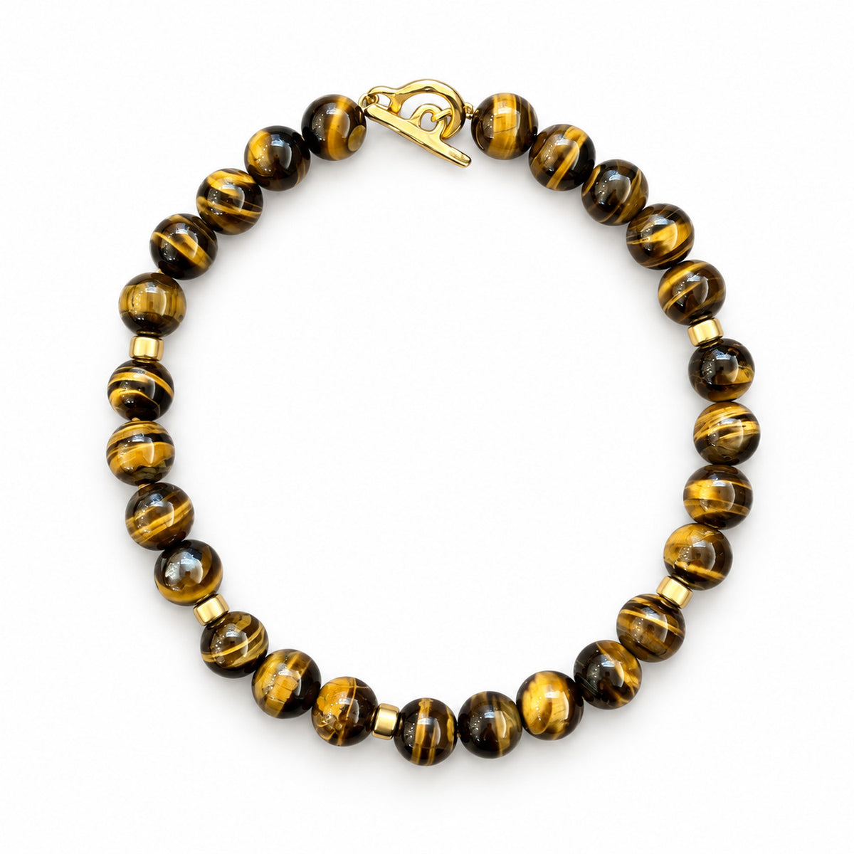 Tiger eye beaded necklace with a gold toggle claps on a white background